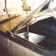 A tank and propane-powered milk agitator on an Amish farm.